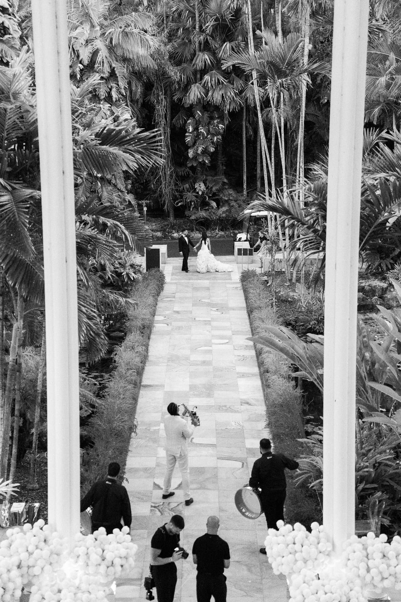 Playing saxophone down the aisle at a garden ceremony